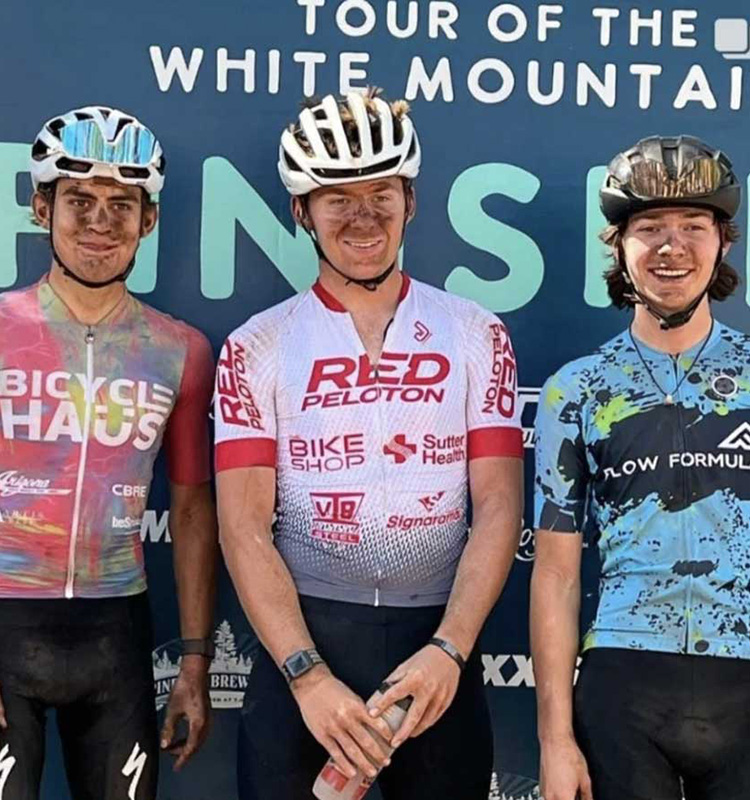Red Peloton U23 rider Grant Feige taking the win at the Tour of White Mountain mountain bike race.