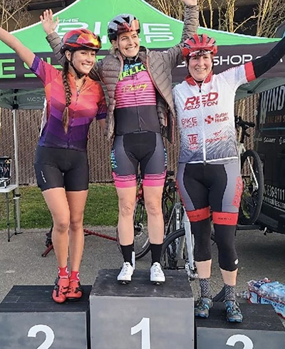 Women’s criterium podium at Tuesday Night Twilights criterium bike race series in Northern California.